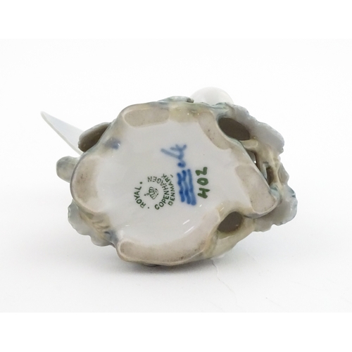 63 - Two Royal Copenhagen models comprising Girl with Doll no. 3539, and Lovebirds no. 402. Marked under.... 