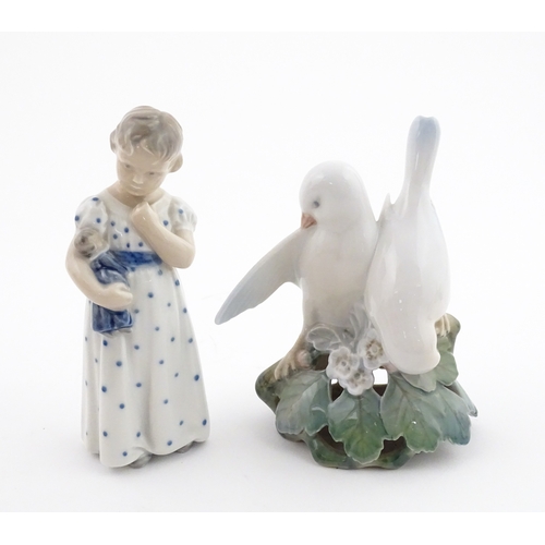 63 - Two Royal Copenhagen models comprising Girl with Doll no. 3539, and Lovebirds no. 402. Marked under.... 