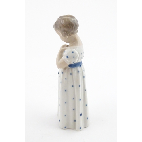 63 - Two Royal Copenhagen models comprising Girl with Doll no. 3539, and Lovebirds no. 402. Marked under.... 