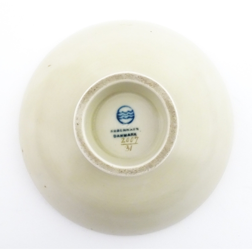 64 - A Royal Copenhagen dish with snowdrop detail, model no. 2685 / 852. Together with a small Kobenhavn ... 