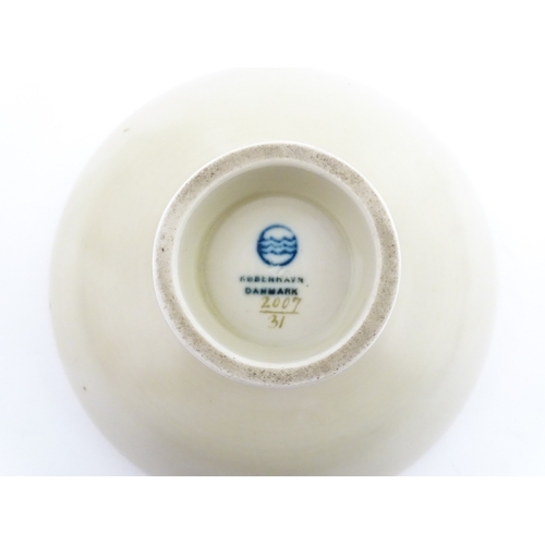 64 - A Royal Copenhagen dish with snowdrop detail, model no. 2685 / 852. Together with a small Kobenhavn ... 