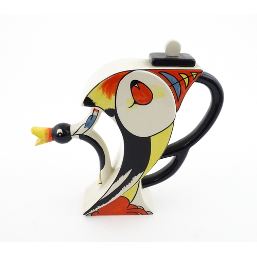 86 - A Lorna Bailey limited edition Puffin teapot. Marked and signed under, and numbered 20 / 50. With ce... 