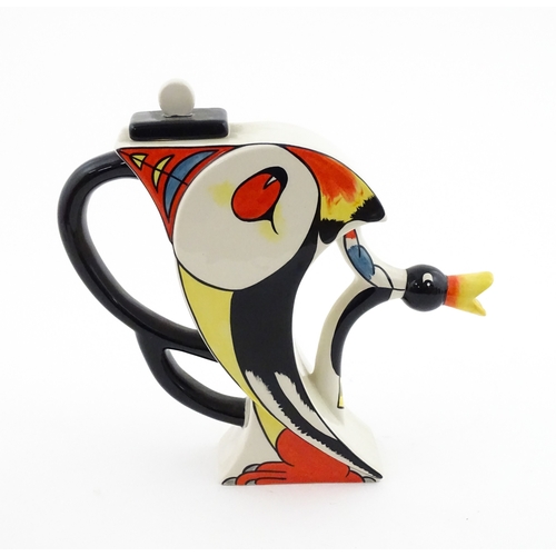 86 - A Lorna Bailey limited edition Puffin teapot. Marked and signed under, and numbered 20 / 50. With ce... 