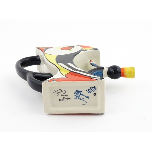86 - A Lorna Bailey limited edition Puffin teapot. Marked and signed under, and numbered 20 / 50. With ce... 