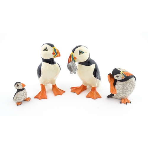 88 - Four studio pottery models of puffins, to include two raku examples by Chloe Harford. Largest approx... 