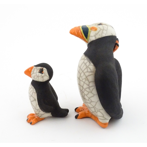 88 - Four studio pottery models of puffins, to include two raku examples by Chloe Harford. Largest approx... 