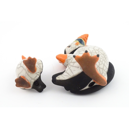 88 - Four studio pottery models of puffins, to include two raku examples by Chloe Harford. Largest approx... 