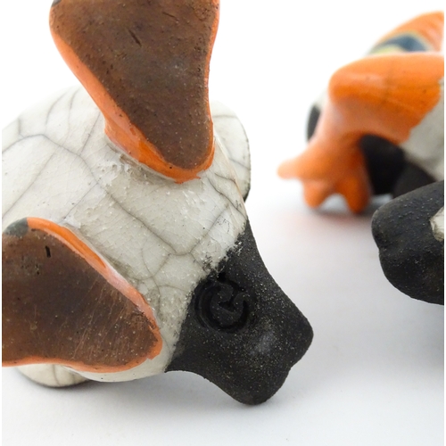 88 - Four studio pottery models of puffins, to include two raku examples by Chloe Harford. Largest approx... 