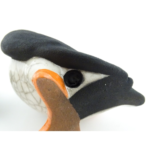 88 - Four studio pottery models of puffins, to include two raku examples by Chloe Harford. Largest approx... 