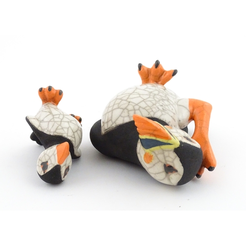 88 - Four studio pottery models of puffins, to include two raku examples by Chloe Harford. Largest approx... 
