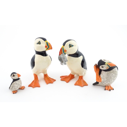 88 - Four studio pottery models of puffins, to include two raku examples by Chloe Harford. Largest approx... 