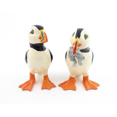 88 - Four studio pottery models of puffins, to include two raku examples by Chloe Harford. Largest approx... 