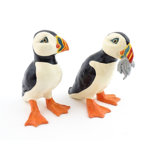 88 - Four studio pottery models of puffins, to include two raku examples by Chloe Harford. Largest approx... 