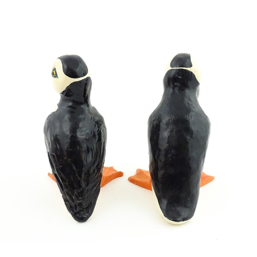 88 - Four studio pottery models of puffins, to include two raku examples by Chloe Harford. Largest approx... 