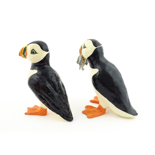 88 - Four studio pottery models of puffins, to include two raku examples by Chloe Harford. Largest approx... 