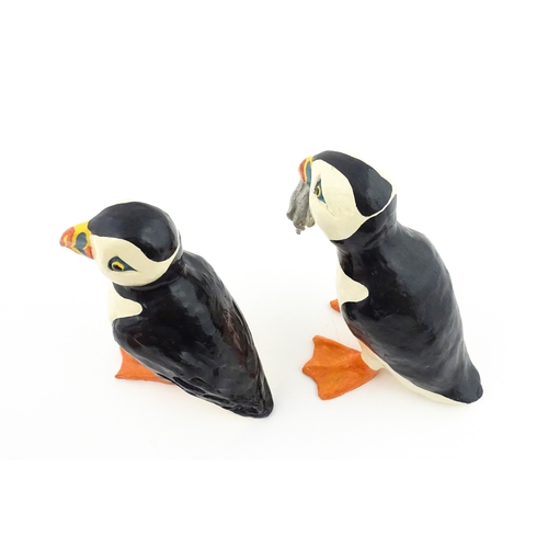 88 - Four studio pottery models of puffins, to include two raku examples by Chloe Harford. Largest approx... 