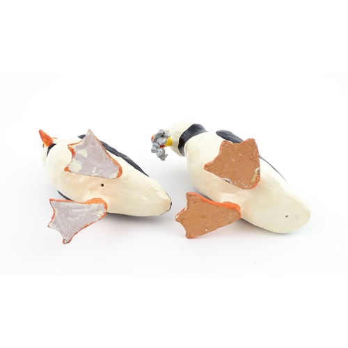 88 - Four studio pottery models of puffins, to include two raku examples by Chloe Harford. Largest approx... 