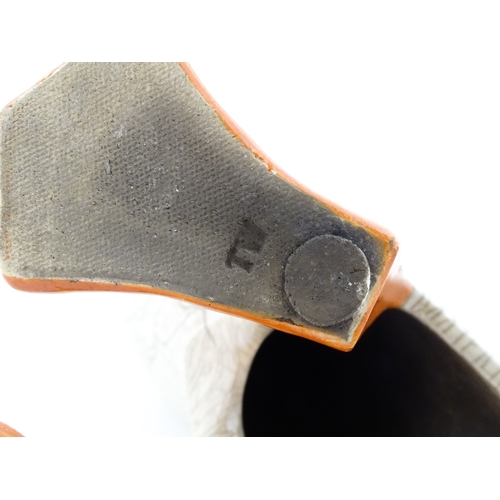 90 - A studio pottery raku fired model of a puffin by Tony White. Marked under. Approx. 9 3/4