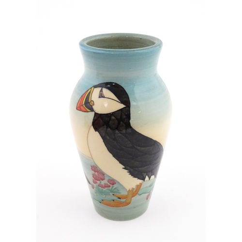 92 - A Dennis China Works vase with puffin detail. Marked under no. 14 / 100. Approx. 8