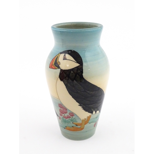 92 - A Dennis China Works vase with puffin detail. Marked under no. 14 / 100. Approx. 8