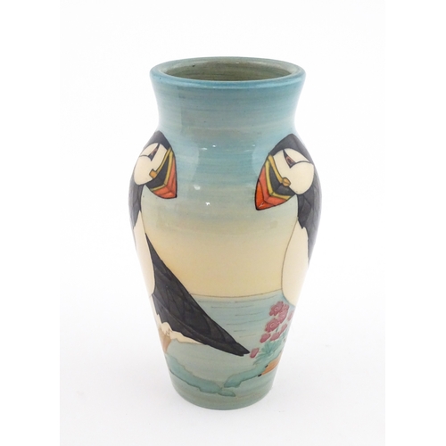 92 - A Dennis China Works vase with puffin detail. Marked under no. 14 / 100. Approx. 8