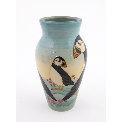 92 - A Dennis China Works vase with puffin detail. Marked under no. 14 / 100. Approx. 8
