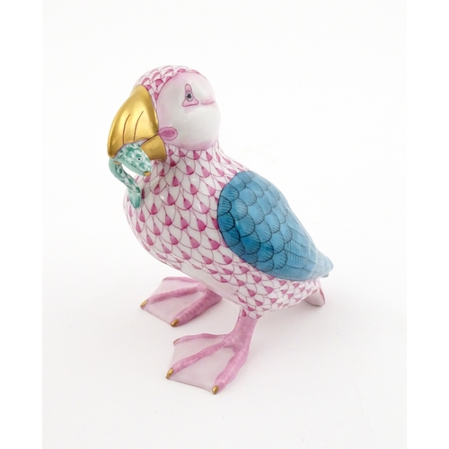 97 - A Herend porcelain model of a Puffin holding a fish in its beak, model no. D2007. Marked under. Appr... 