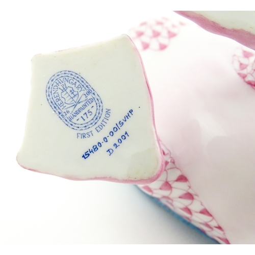 97 - A Herend porcelain model of a Puffin holding a fish in its beak, model no. D2007. Marked under. Appr... 