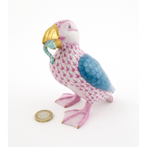 97 - A Herend porcelain model of a Puffin holding a fish in its beak, model no. D2007. Marked under. Appr... 