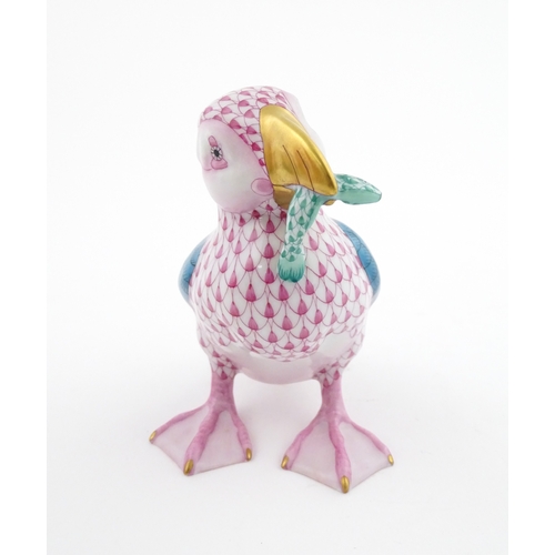 97 - A Herend porcelain model of a Puffin holding a fish in its beak, model no. D2007. Marked under. Appr... 