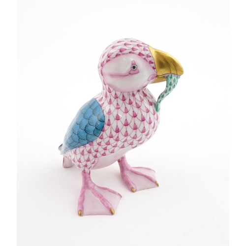 97 - A Herend porcelain model of a Puffin holding a fish in its beak, model no. D2007. Marked under. Appr... 
