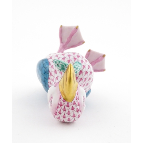 97 - A Herend porcelain model of a Puffin holding a fish in its beak, model no. D2007. Marked under. Appr... 