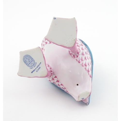 97 - A Herend porcelain model of a Puffin holding a fish in its beak, model no. D2007. Marked under. Appr... 