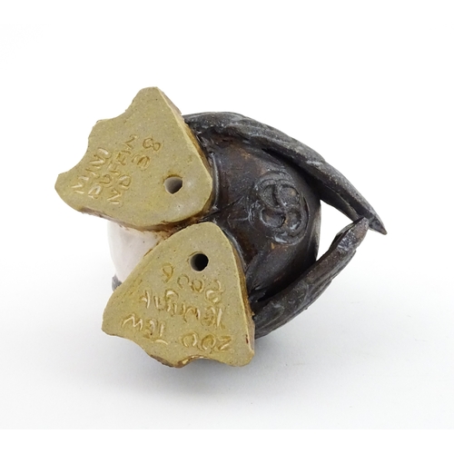 98 - A Zoo Original studio pottery model of a Puffin. Signed under Mini Puffin, no. 58. Approx. 4