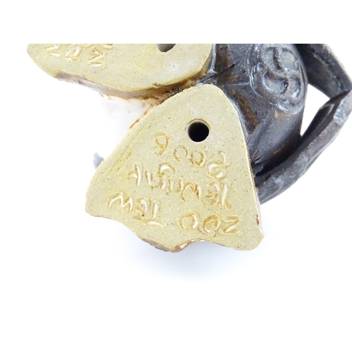 98 - A Zoo Original studio pottery model of a Puffin. Signed under Mini Puffin, no. 58. Approx. 4