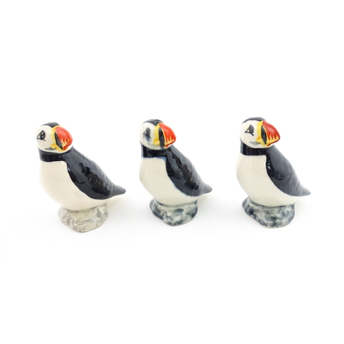 99 - Three Babbacombe Pottery cruets modelled as Puffins. Marked under. Approx. 3 1/4