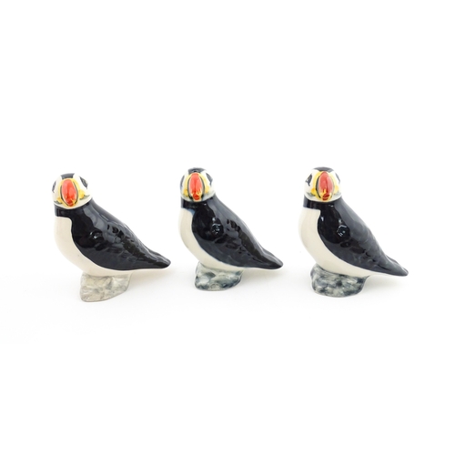 99 - Three Babbacombe Pottery cruets modelled as Puffins. Marked under. Approx. 3 1/4