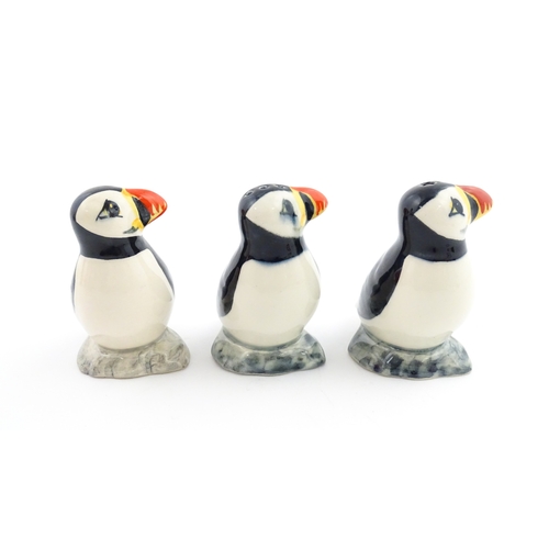 99 - Three Babbacombe Pottery cruets modelled as Puffins. Marked under. Approx. 3 1/4