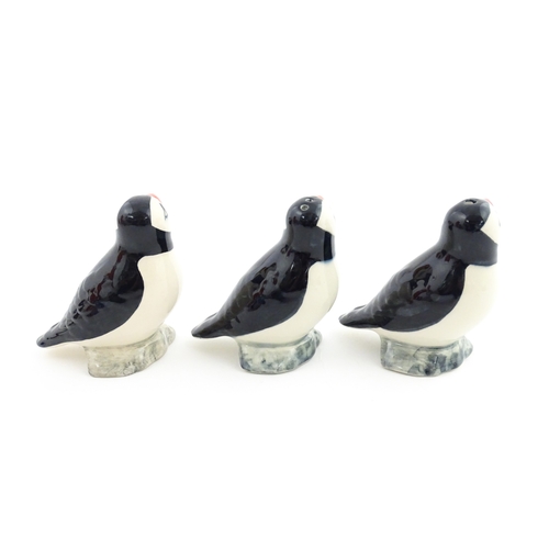 99 - Three Babbacombe Pottery cruets modelled as Puffins. Marked under. Approx. 3 1/4