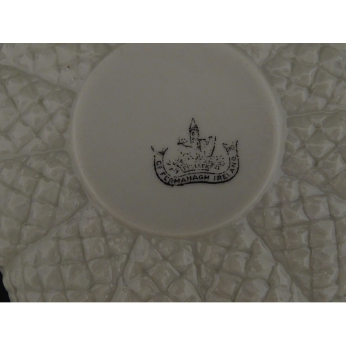 72 - A Belleek tea set in the Cone pattern, comprising teapot, milk jug, sugar bowl and four cups and sau... 