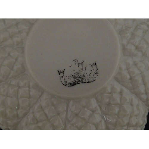 72 - A Belleek tea set in the Cone pattern, comprising teapot, milk jug, sugar bowl and four cups and sau... 