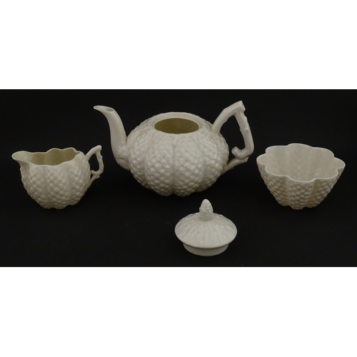 72 - A Belleek tea set in the Cone pattern, comprising teapot, milk jug, sugar bowl and four cups and sau... 