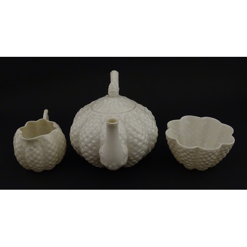 72 - A Belleek tea set in the Cone pattern, comprising teapot, milk jug, sugar bowl and four cups and sau... 