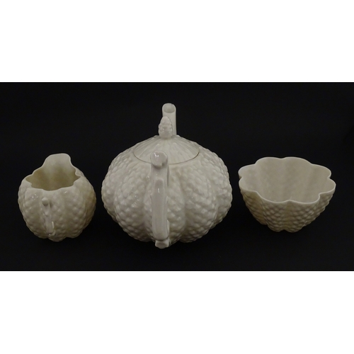72 - A Belleek tea set in the Cone pattern, comprising teapot, milk jug, sugar bowl and four cups and sau... 