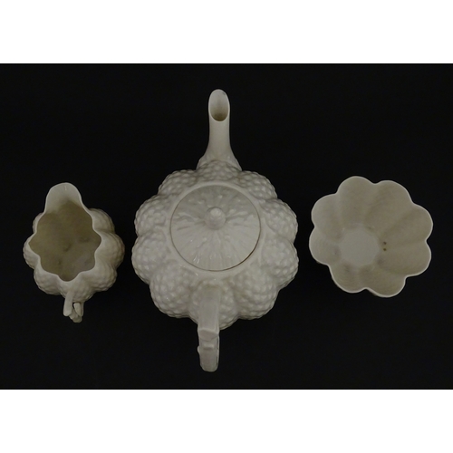 72 - A Belleek tea set in the Cone pattern, comprising teapot, milk jug, sugar bowl and four cups and sau... 