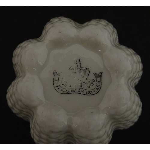 72 - A Belleek tea set in the Cone pattern, comprising teapot, milk jug, sugar bowl and four cups and sau... 