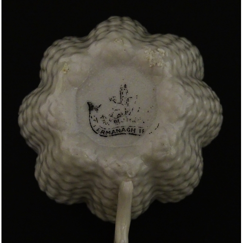 72 - A Belleek tea set in the Cone pattern, comprising teapot, milk jug, sugar bowl and four cups and sau... 