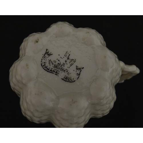 72 - A Belleek tea set in the Cone pattern, comprising teapot, milk jug, sugar bowl and four cups and sau... 