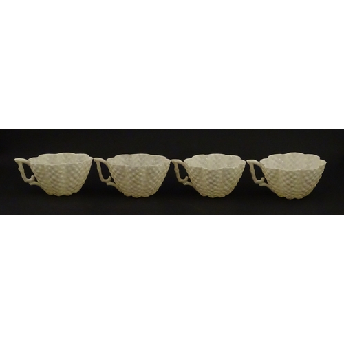 72 - A Belleek tea set in the Cone pattern, comprising teapot, milk jug, sugar bowl and four cups and sau... 