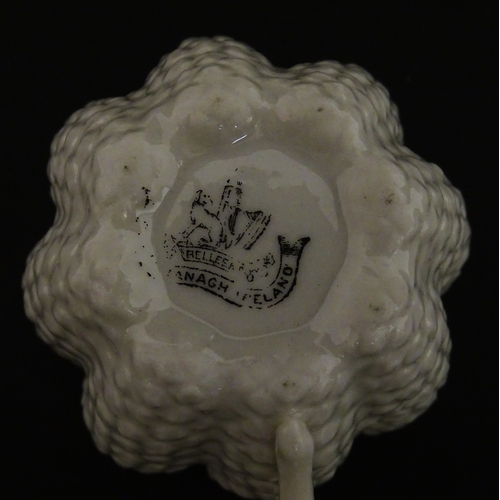 72 - A Belleek tea set in the Cone pattern, comprising teapot, milk jug, sugar bowl and four cups and sau... 